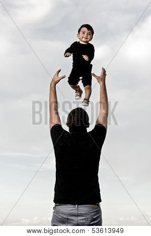 Happy Dad With Baby At The Beach
