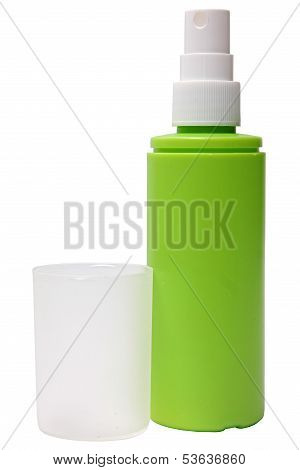 Green plastic bottle of spray isolated on a white background.