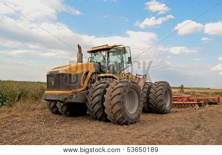 Tractor Processes Field