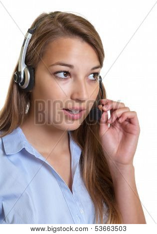 Beautiful female operator talking at phone