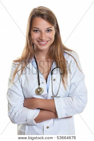 Laughing female doctor with crossed arms