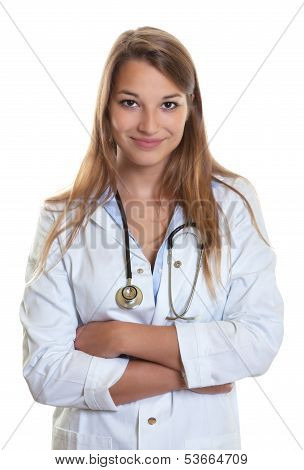 Female doctor with crossed arms smiling at camera