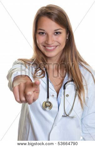 Female doctor pointing at camera