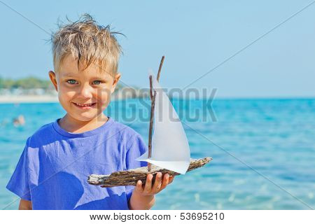 boy with toy ship