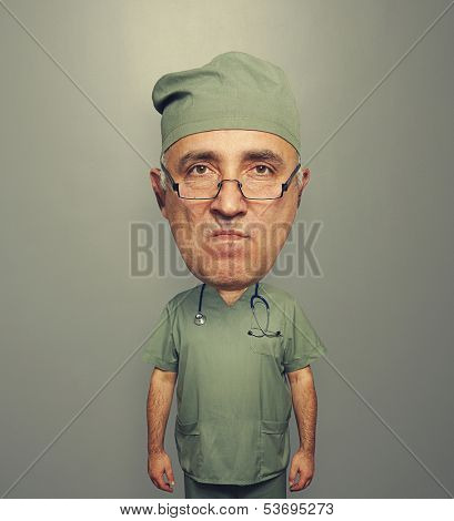 dissatisfied bighead doctor in uniform over grey background
