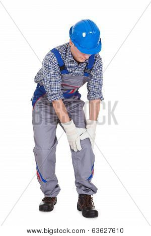 Male Worker Suffering From Knee Pain
