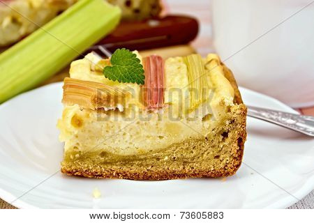 Pie with curd and rhubarb on plate