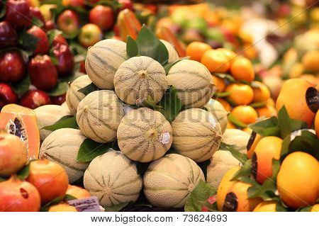 Ripe Fresh Melons Pile In A Market.