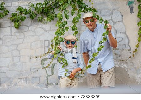 Happy father and son having fun outdoors in city
