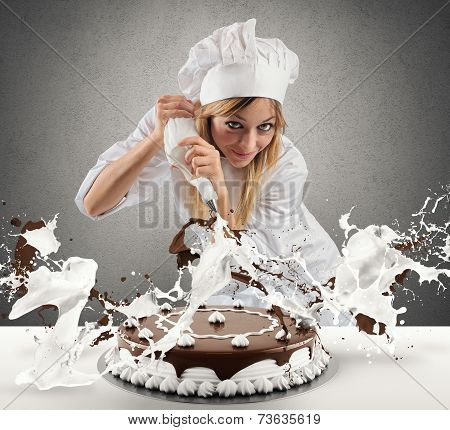 Pastry Cook Prepares A Cake
