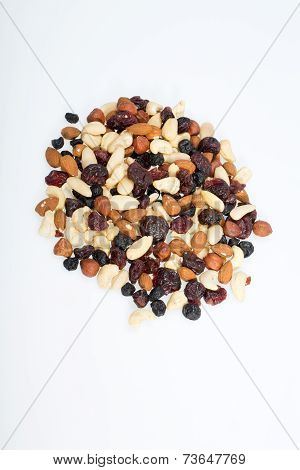 mixed nuts and dried fruits isolated on white background