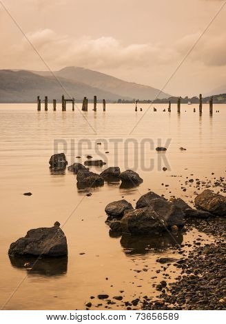 Loch Lomond Jetty And Mountains At Sunset