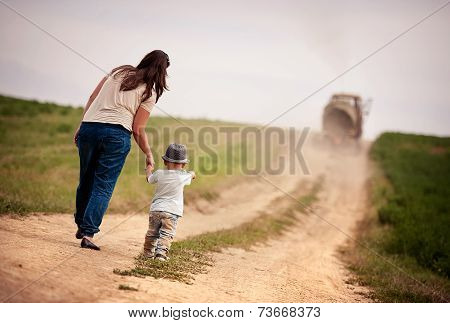 Mother with little boy walking in nature