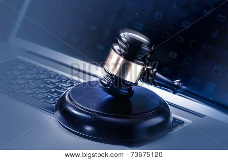 Gavel on Computer - cyber law crime concept image. 