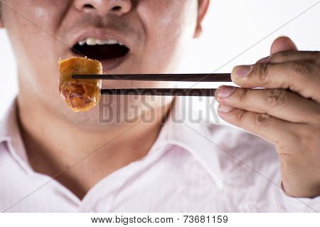 Man With Chopsticks Eat Egg Springroll