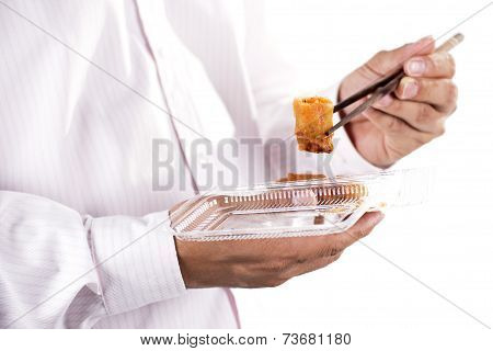 Man With Chopsticks Eat Egg Springroll
