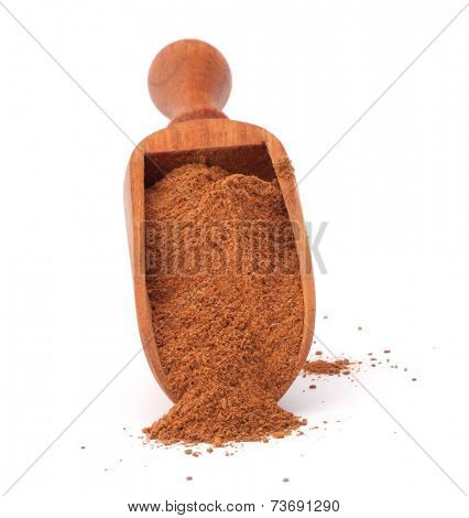 ground cinnamon spice powder in wooden spoon isolated on white background cutout