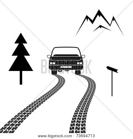 Car driving on a mountain road with tire tracks
