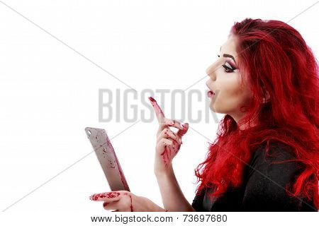 redhead woman with a bloody hatchet in hand
