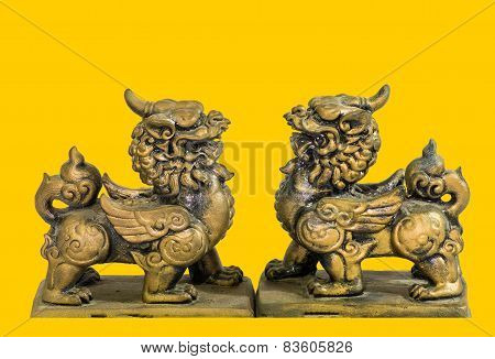 Chinese talisman figurine yellow background
