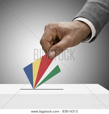 Black Male Holding Flag. Voting Concept - Republic Of Seychelles