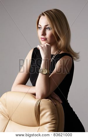 Attractive Woman Leaning On Armchair