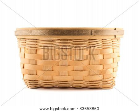 Wooden wicker basket isolated over white