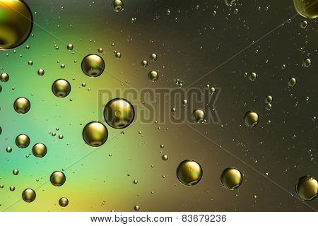 Blue, green, brown and gold oil and water abstract