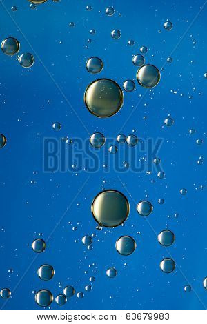 Blue and gold oil and water abstract