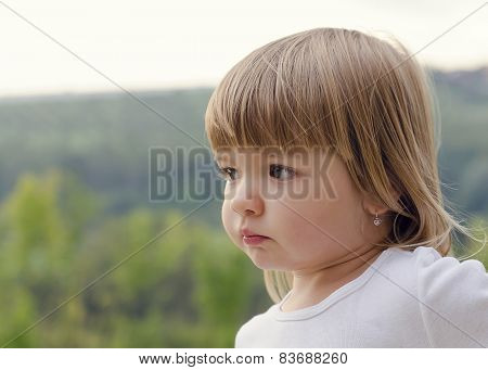 Potrait Of A Child Girl Outside