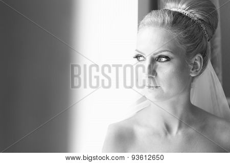 Black And White Portrait Of A Bride Near Window