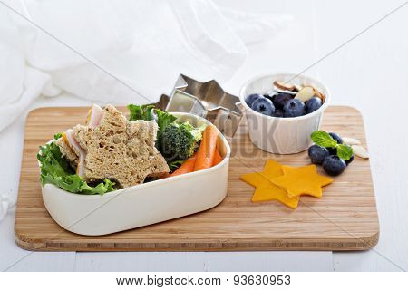 Lunch box with sandwich and salad