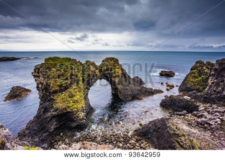 Picturesque fantastic coastal cliffs Arnastapi. Travel to Iceland in the summer