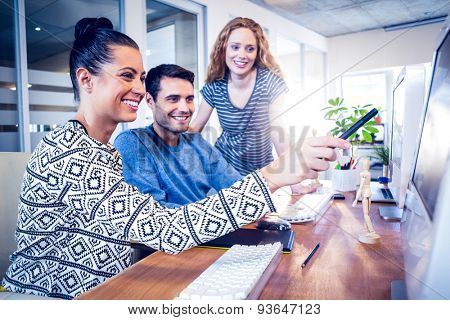 Happy designers working together in creative office