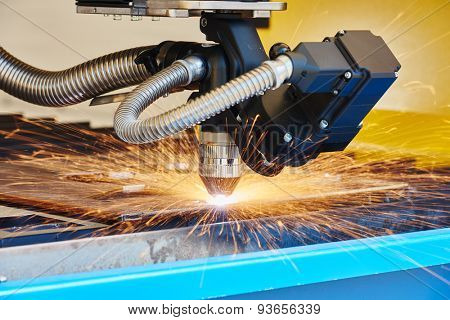 metal working. Plasma or Laser cutting technology of flat sheet metal steel material with sparks