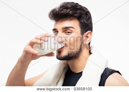 Fitness man drinking milk isolated on a white background