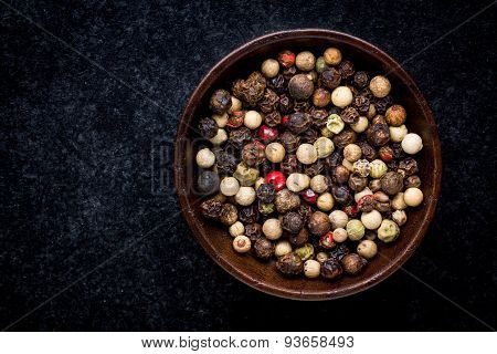 Peppercorns In A Wooden Bowl