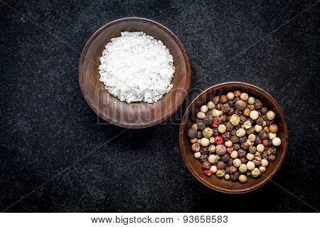 Peppercorns And Sea Salt In A Wooden Bowl