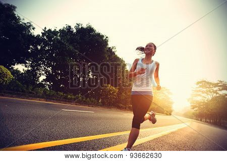 Runner athlete running at road. woman fitness sunrise jogging workout wellness concept.vintage effec