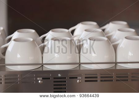 Empty coffee cup on coffee machine