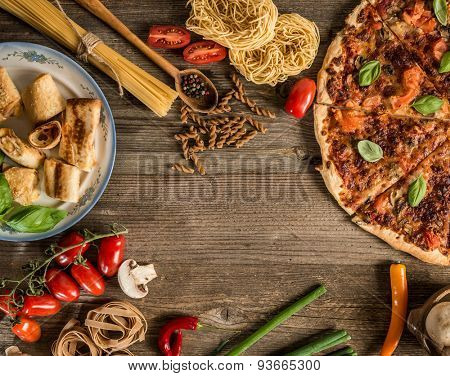 Italian food background with space for text  on wooden table
