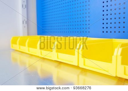 The image of working place with boxes from small ironware