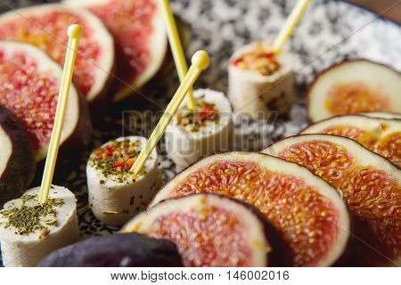 Juicy Ripe Figs On A Plate With Goat Cheese And Liqueur. Wooden