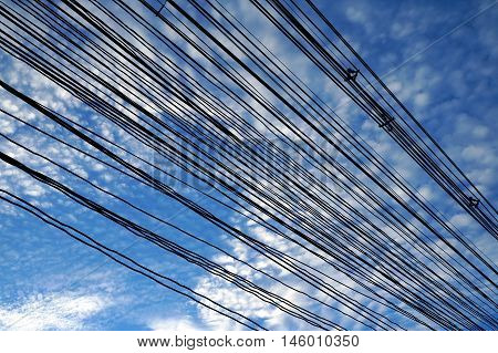 Street electric wiring at deep blue sky background