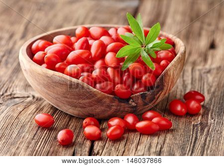 Goji berries on a wooden board