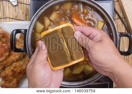 Chef prepared putting curry pasted for cooking / cooking Japanese pork curry paste concept