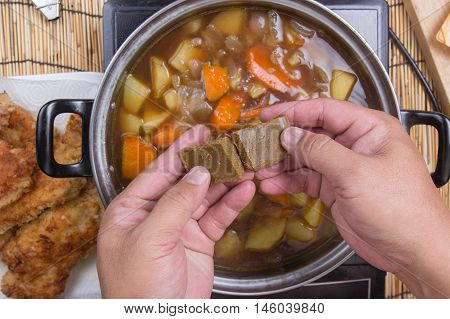 Chef prepared putting curry pasted for cooking / cooking Japanese pork curry paste concept