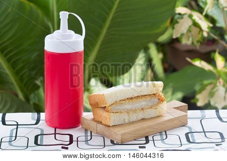 Tongkatsu pork sandwich on the wooden plate