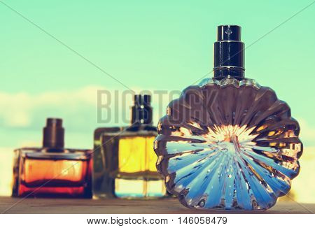different bottle of female perfume  in blue background