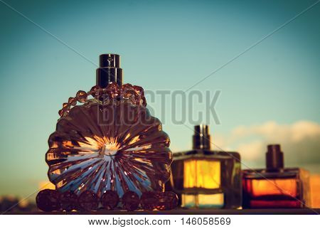Multicolored perfumes in bottles of different shapes